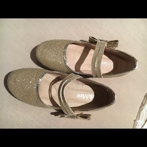 Young girls gold glitter party shoes.